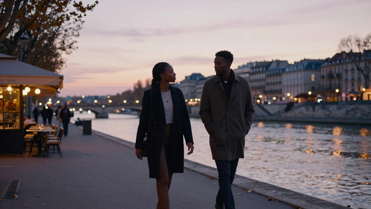 A woman and man walk peacefully along the Seine at sunset, lost in quiet conversation under soft streetlights.